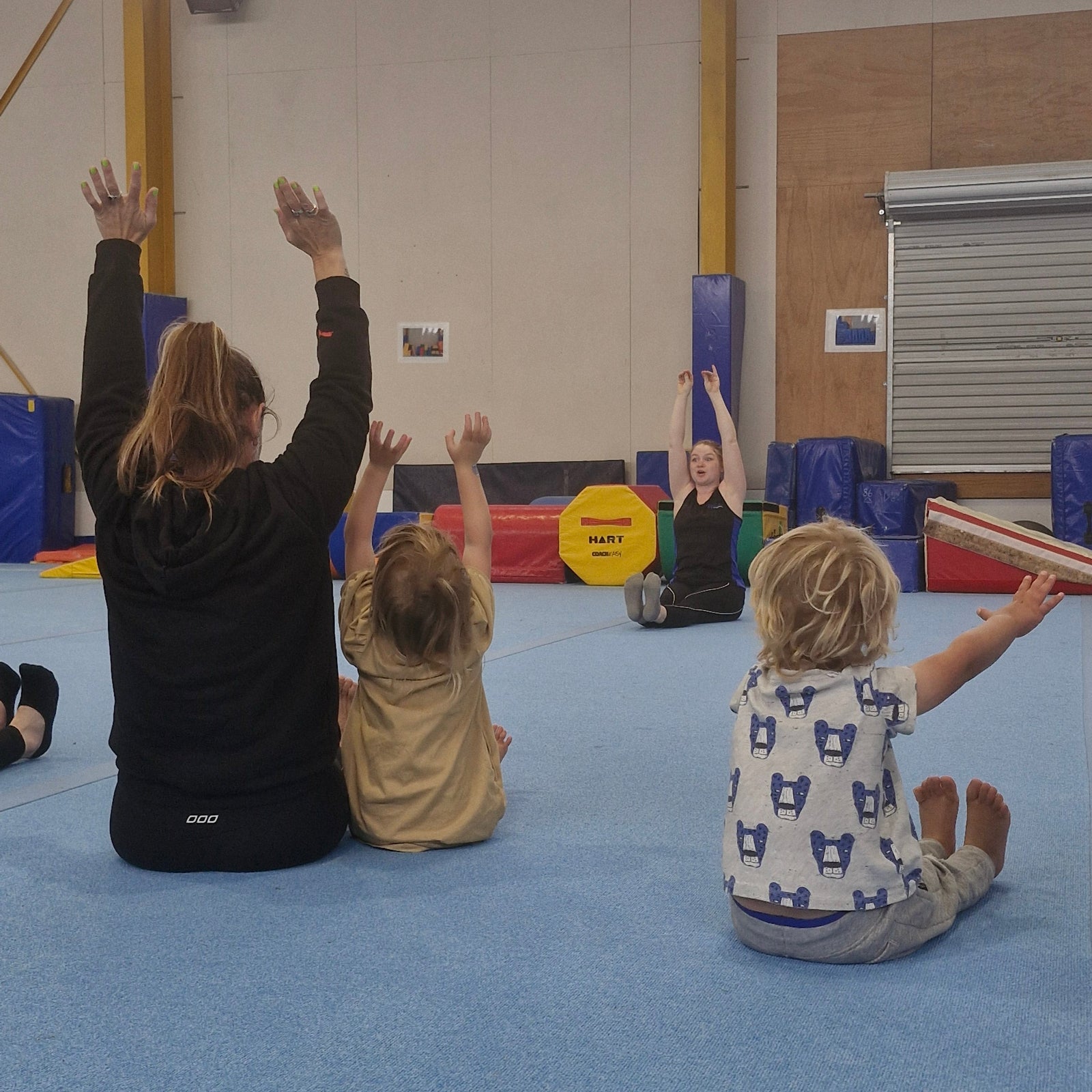 Parent and Child doing stretches during Preschool Gymnastics